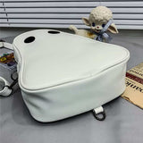 Halloween cartoon ghost shaped white bag with black eyes on gray surface