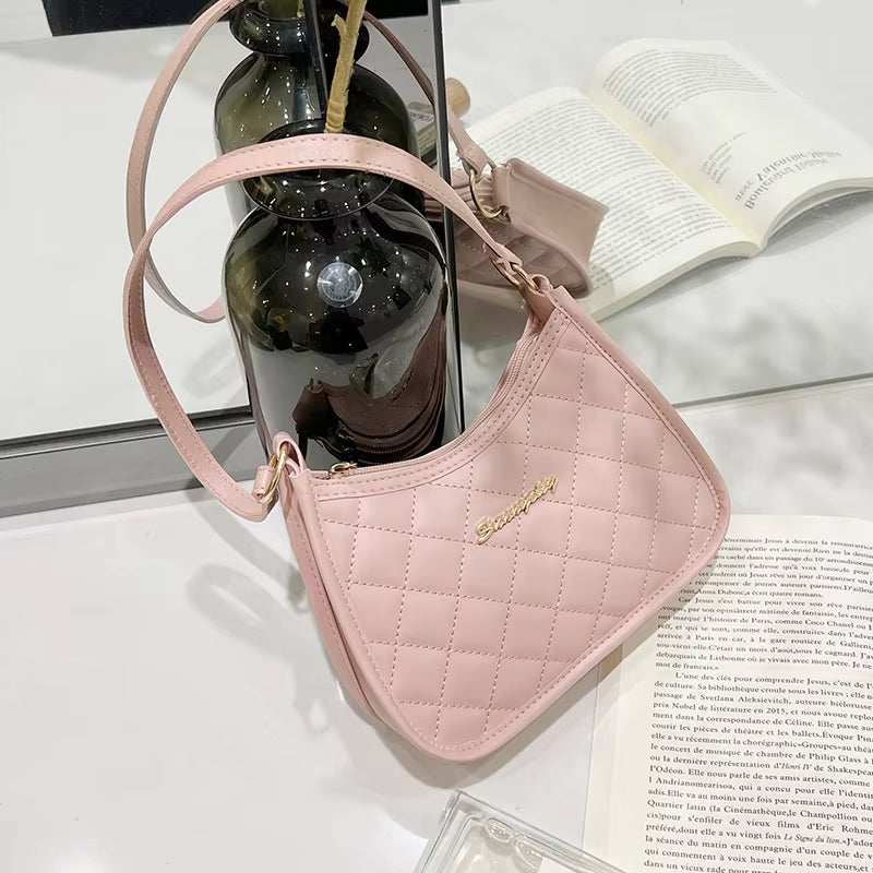 Pink quilted PU leather ball purse for teenagers with shoulder strap and gold-tone logo detail