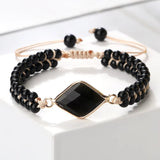 Natural stone beads bracelet with black onyx beads and central black gemstone on adjustable cord