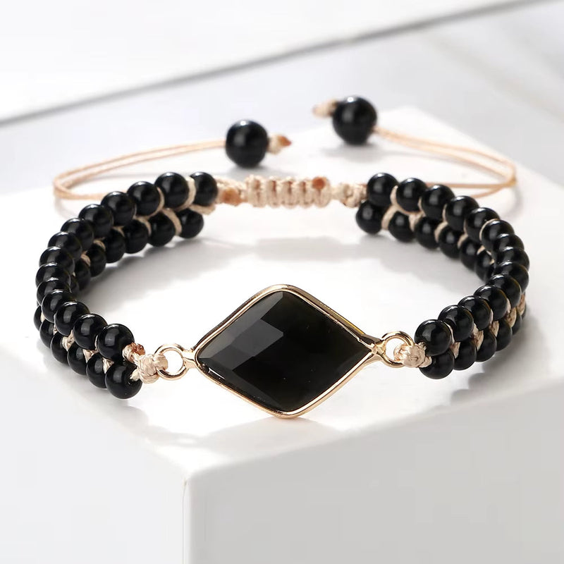 Natural stone beads bracelet with black onyx beads and central black gemstone on adjustable cord