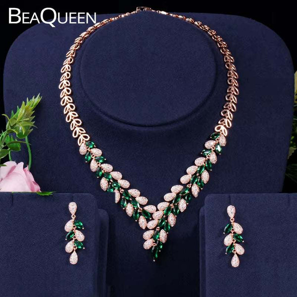 Dubai Gold Color BeaQueen luxury gold-plated cubic zirconia green and white crystal necklace and earrings set on navy display