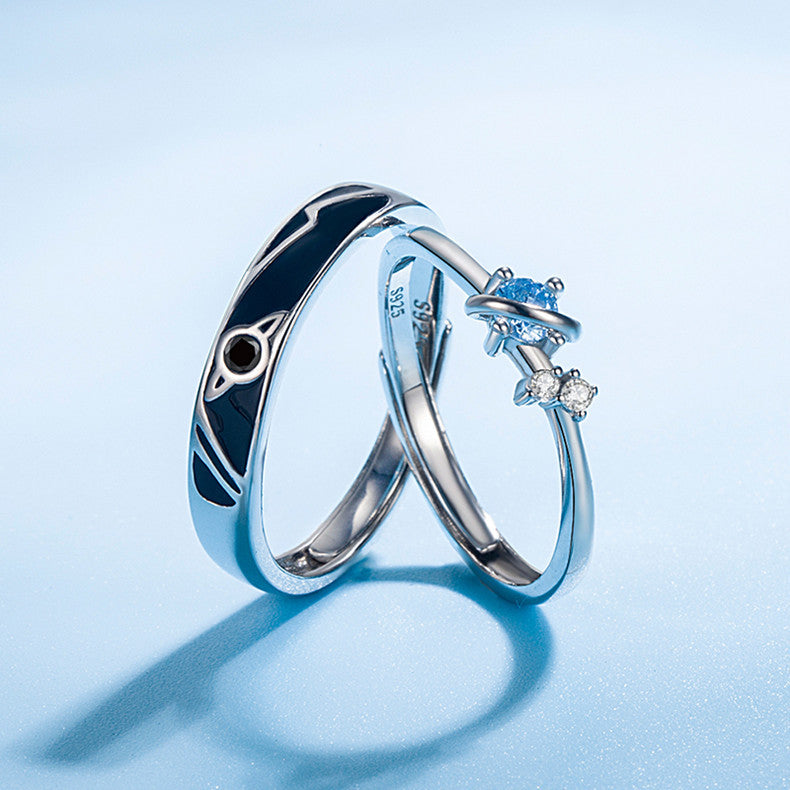 Silver Dream Planet Couple Rings with geometric design and blue gemstone accents