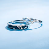 Dream Planet Couple Rings set in 925 sterling silver with geometric design and gemstone accents on light blue background