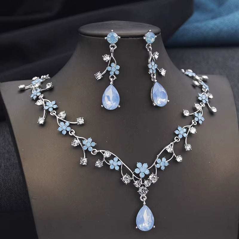 Silver plated Rhinestone Water Drop necklace and earrings set with blue floral accents and crystal detailing