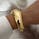 Punk Vintage Irregular glossy gold chunky cuff bangle bracelet on wrist