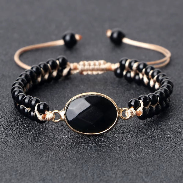 Adjustable natural stone beads bracelet with shiny black onyx centerpiece and black obsidian beads