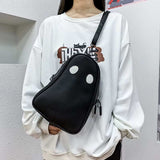 Black Halloween cartoon ghost-shaped crossbody bag with white eyes worn with white oversized sweatshirt