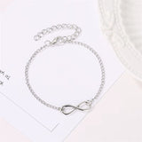Golden silver color infinity bracelet with adjustable chain and number 8 charm for women