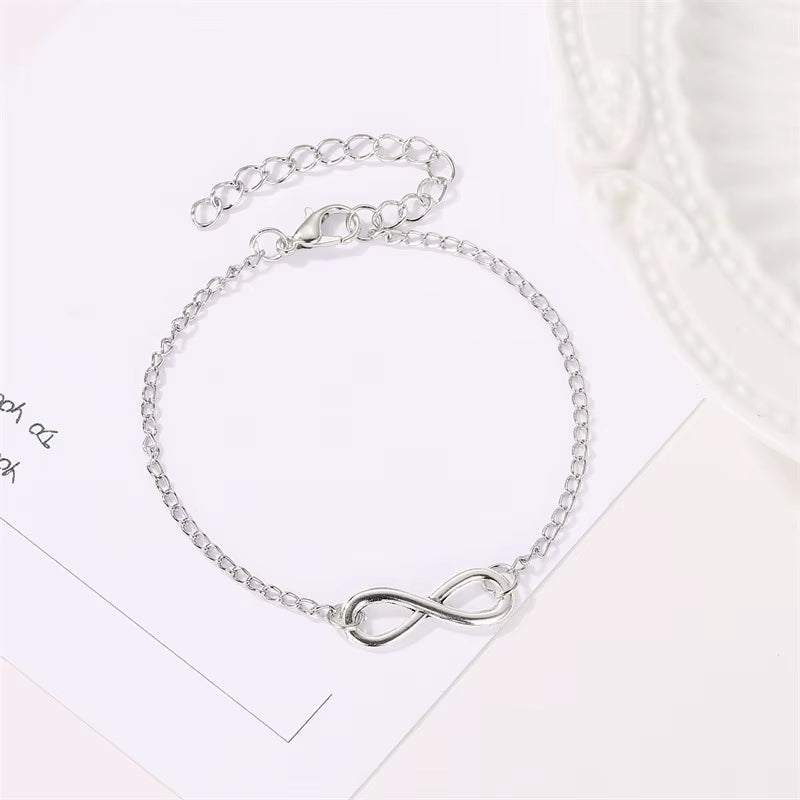 Golden silver color infinity bracelet with adjustable chain and number 8 charm for women