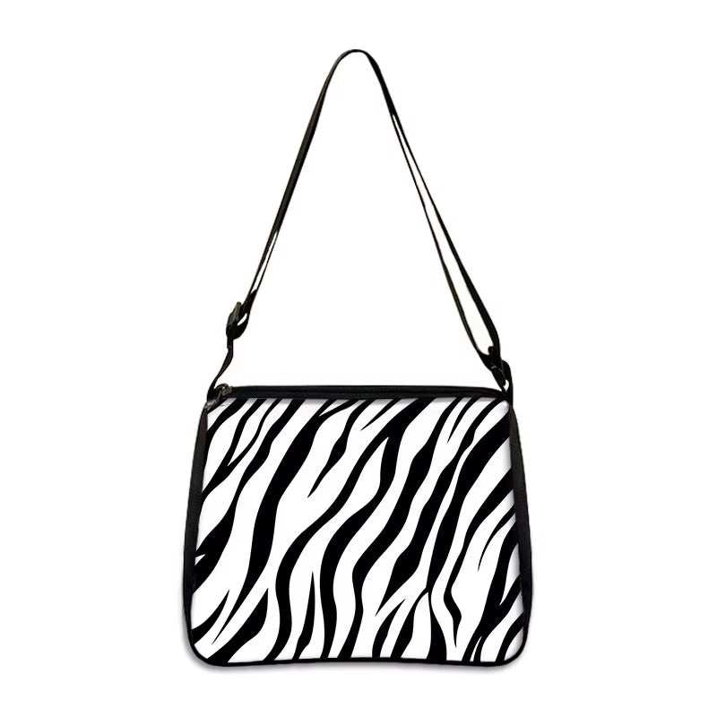 Black and white zebra print small shoulder bag with adjustable strap