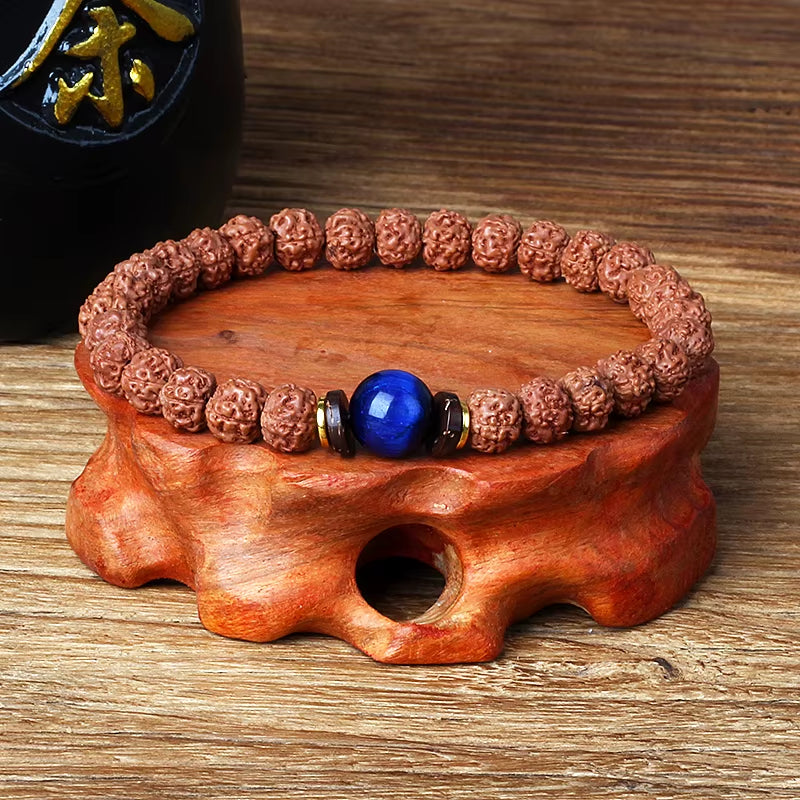 Royal Green Tiger Eye Vajra Rudraksha meditation beaded bracelet on wooden stand