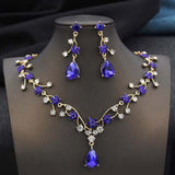 Gold plated rhinestone water drop necklace and earrings set with purple crystals and clear rhinestones