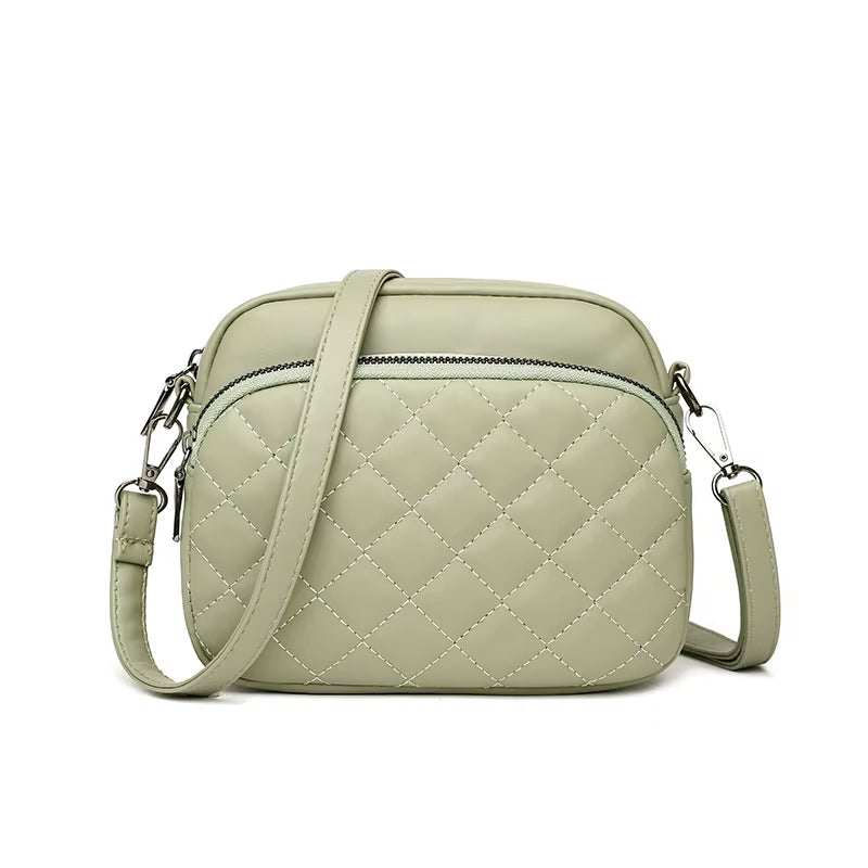 Diamond lattice pattern women's shoulder bag in light green PU leather with adjustable strap and front zipper pocket