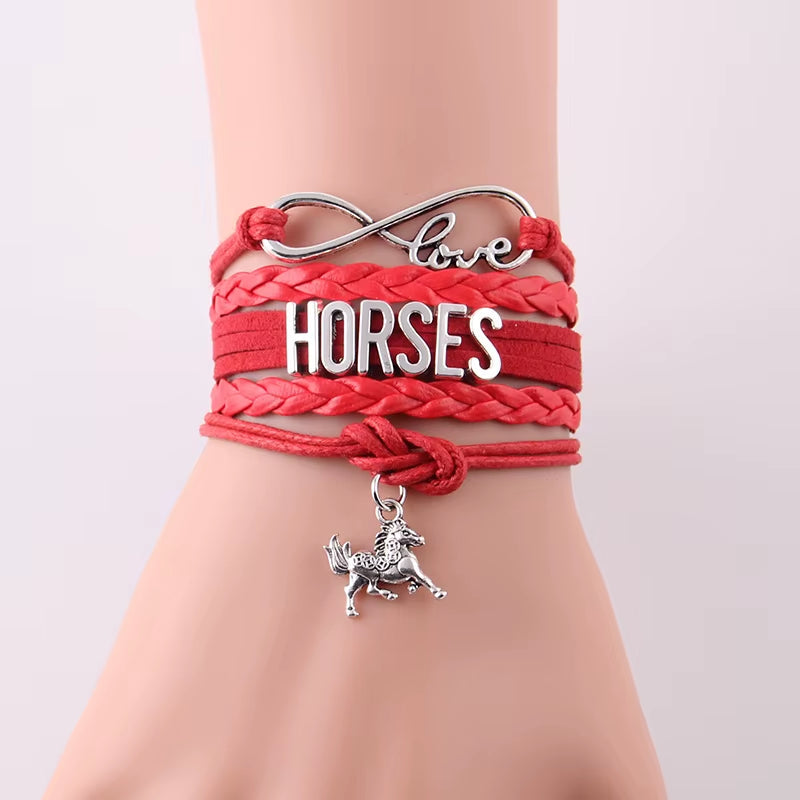 red Infinity Love Horses bracelet with horse charm and leather braid wrap on wrist