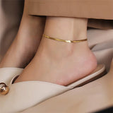 316L stainless steel gold anklet on ankle with beige shoes