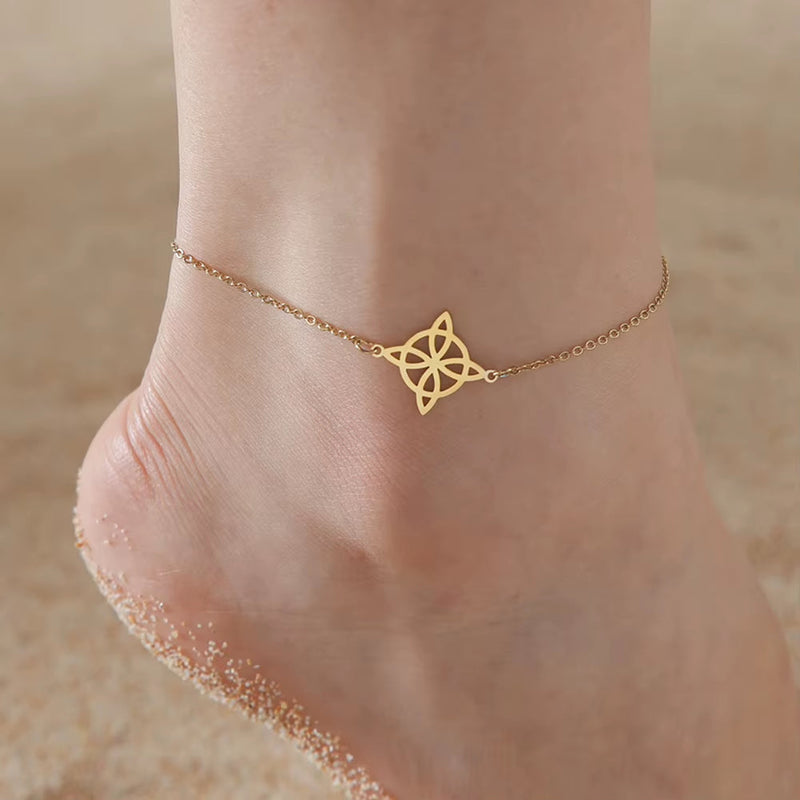 Gold Knot Pendant Anklet on sandy ankle, delicate stainless steel chain jewelry