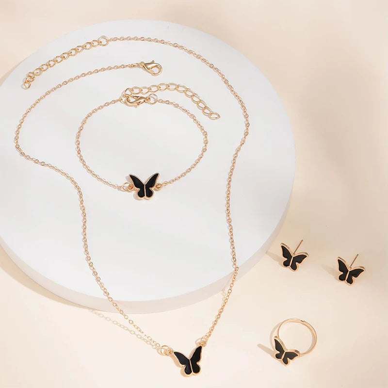 Butterfly pendants necklace set with matching bracelet, earrings, and ring in gold and black alloy design