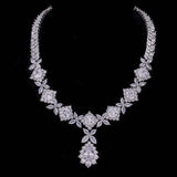 Elegant cubic zirconia tassel drop necklace with floral and square stone design