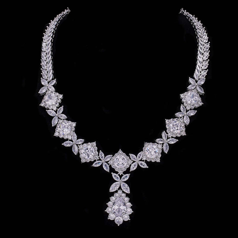Elegant cubic zirconia tassel drop necklace with floral and square stone design