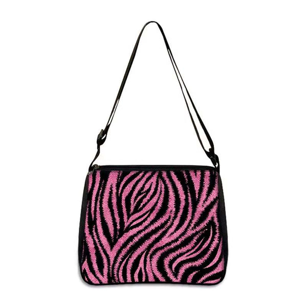 Small shoulder bag with pink and black zebra print design and adjustable strap