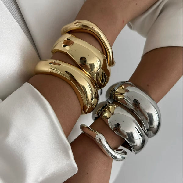 Punk Vintage Irregular chunky glossy gold and silver cuff bangles on wrists