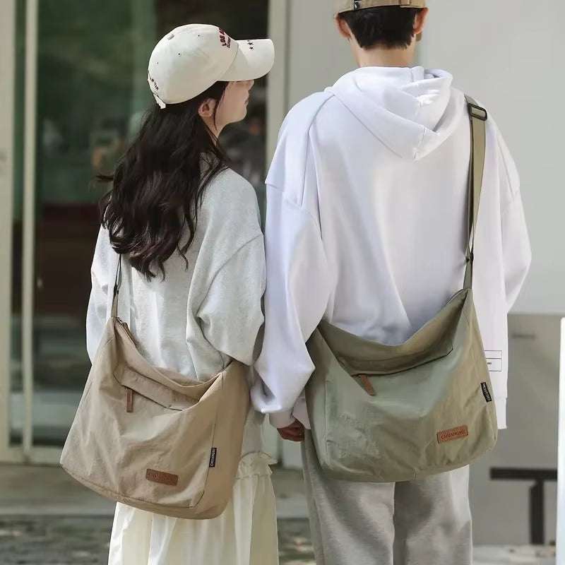 Japanese style unisex shoulder bags worn by man and woman