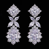 Pair of elegant cubic zirconia tassel drop earrings with intricate crystal design on black background