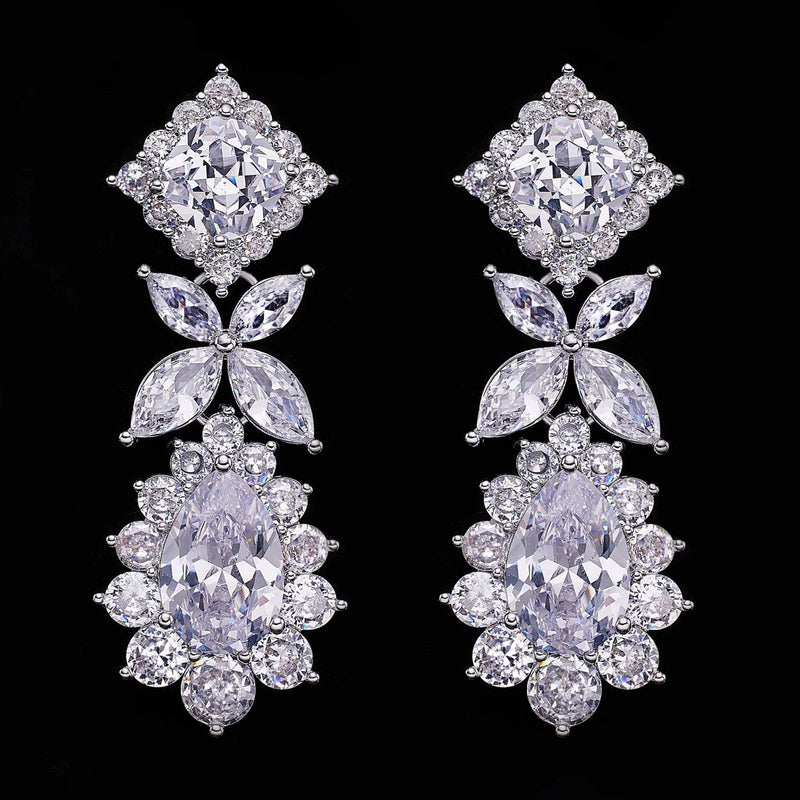 Pair of elegant cubic zirconia tassel drop earrings with intricate crystal design on black background