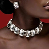 Stonefans Bride Crystal Necklace Earrings Set with large rectangular crystals on dark skin against red background