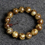 Nature Bodhi 18 Style Beads Bracelet with natural Rudraksha beads on grey background