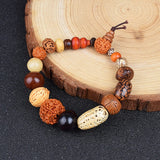 Nature Bodhi 18 Style Beads Bracelet with mixed wooden and Rudraksha beads on wooden surface