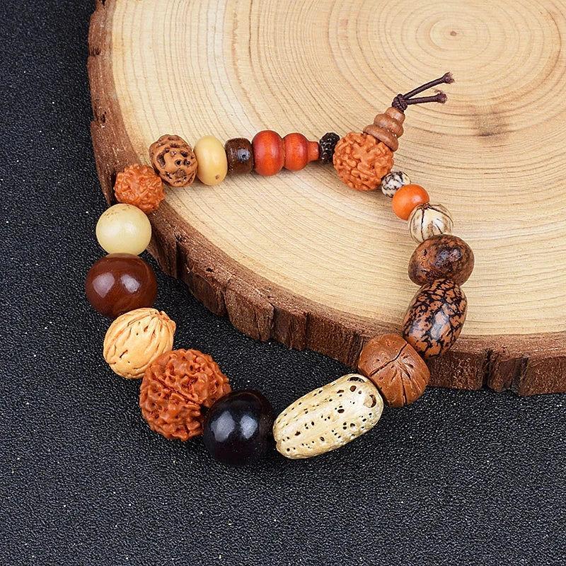 Nature Bodhi 18 Style Beads Bracelets with mixed natural wood and Rudraksha beads on black surface.