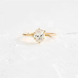 Elegant geometry egg shape crystal gold ring with zircon stone on white background