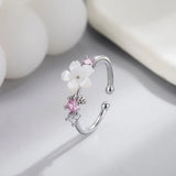 Silver open band pink romantic flower ring with white petals and pink gemstones