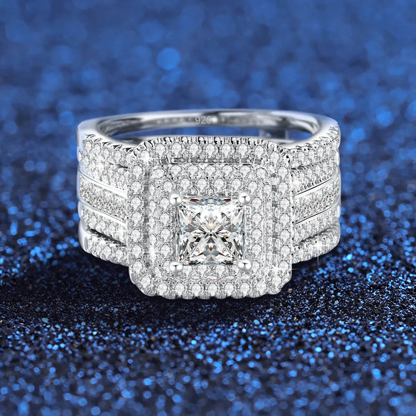 Princess cut moissanite rings set with square 0.8ct VVS1 D color stones in 925 sterling silver on blue glitter background