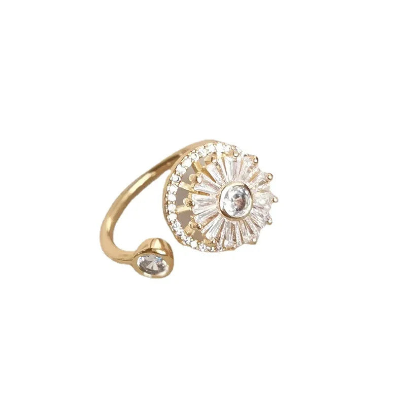 gold fidget spinner ring with crystal flower design and open band