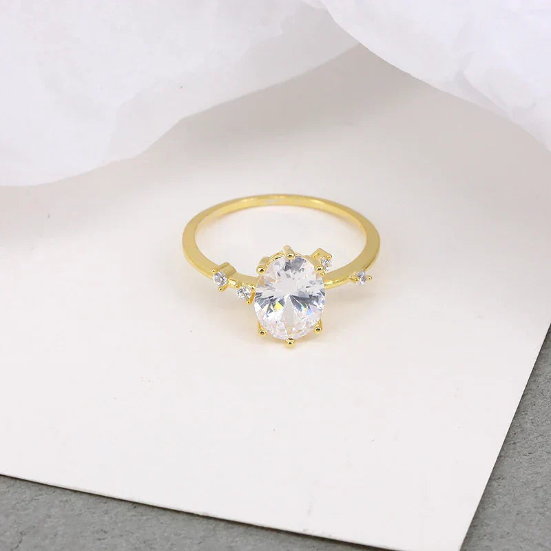 Elegant Geometry Egg Shape Crystal gold ring with zircon stone on white background