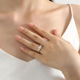 Elegant 18K gold ring with natural white moissanite stones on woman's hand