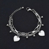 Nextvance Chain Link stainless steel heart charm bracelet for women on black background