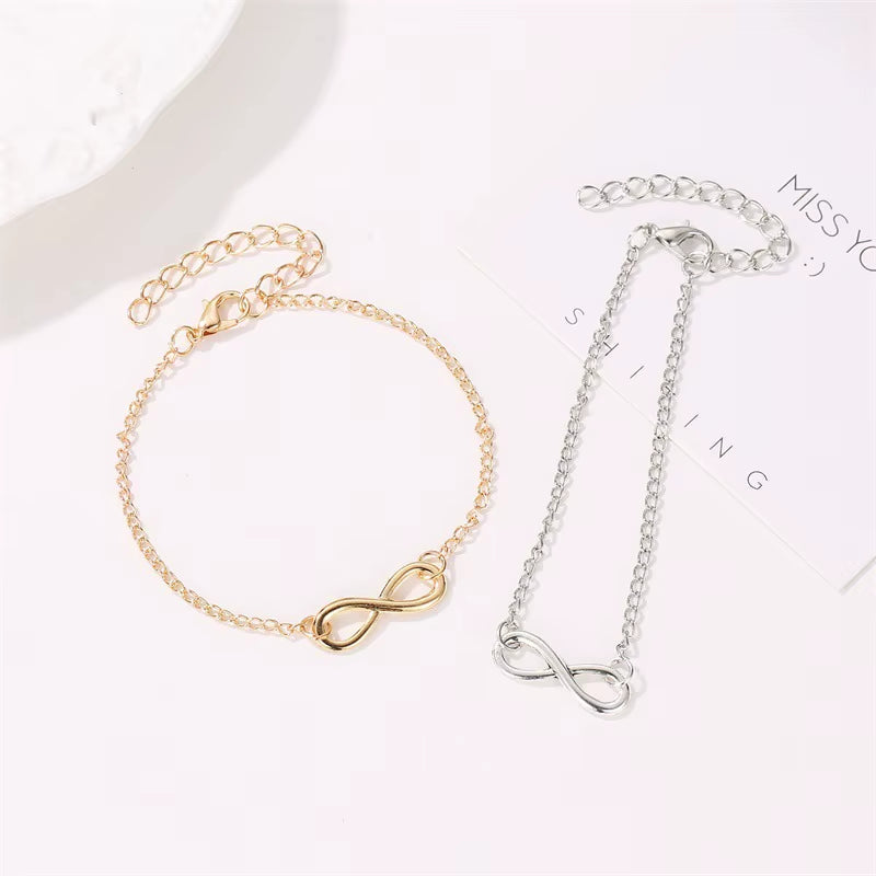 Golden and silver infinity symbol bracelets with adjustable chains for women