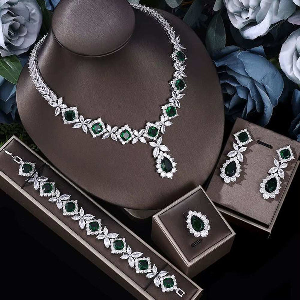 Cubic Zirconia Tassel Drop jewelry set with green stones, including necklace, bracelet, ring, and earrings