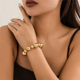 woman wearing gold goth vintage big CCB chain bracelet on wrist