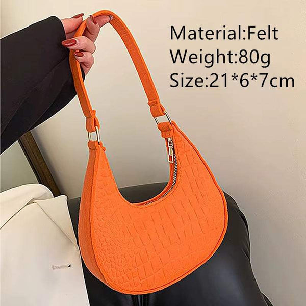 Orange felt ball purse for teenagers with shoulder strap and zipper closure