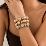 Goth vintage big CCB chain bracelets in gold and silver on wrist