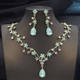 Rhinestone water drop necklace and earrings set with gold plated floral design and crystals