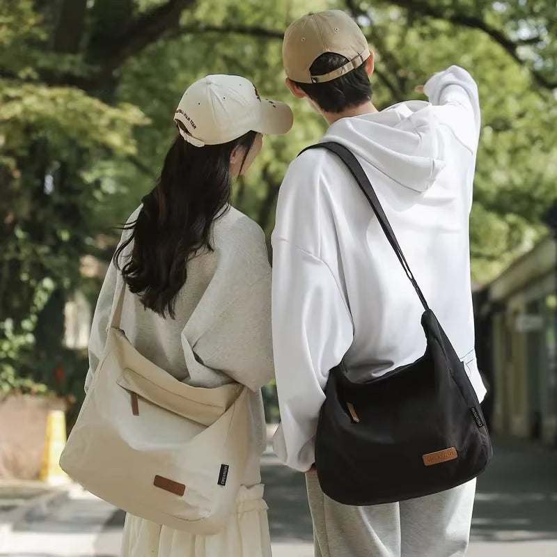 Japanese women and men wearing casual shoulder bags outdoors in beige and black colors