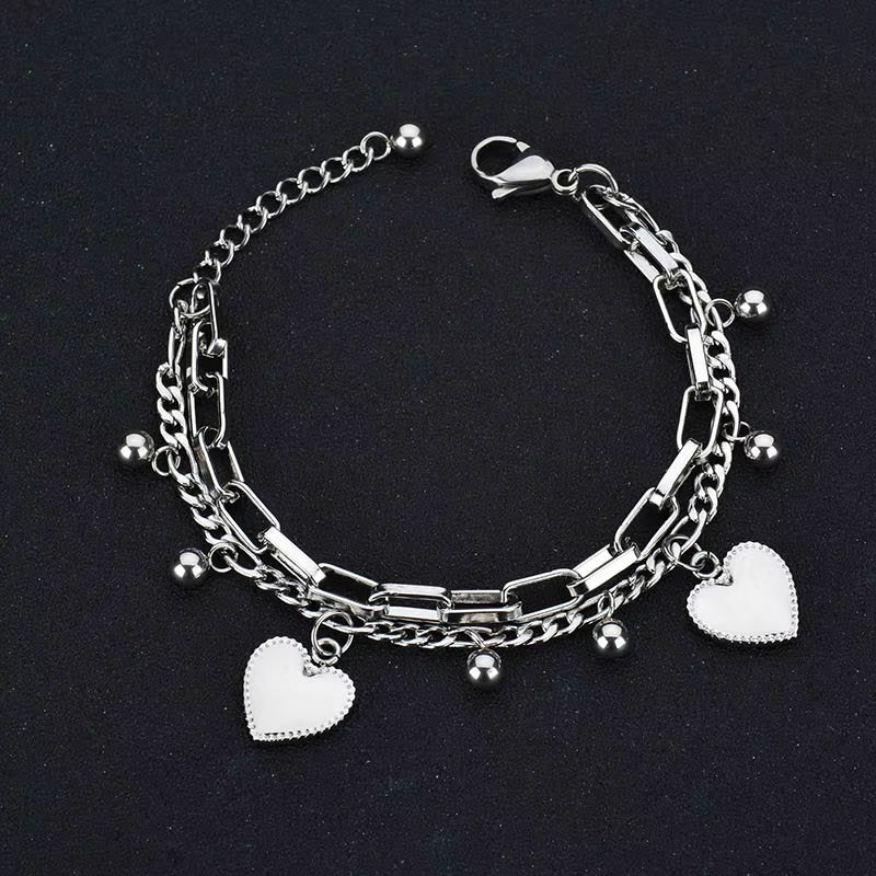 Nextvance Chain Link stainless steel bracelet with heart charms and dangling beads for women