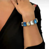 Big Rectangle Stone rhinestone bracelet with large crystals in blue, yellow, and clear colors on woman's wrist