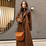 Luxury Brand Rodeo Women Bags brown suede leather shoulder crossbody bag with flap closure worn by woman in brown coat