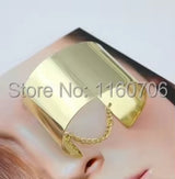 metallic gold chained bracelet with wide cuff design and delicate chain detail